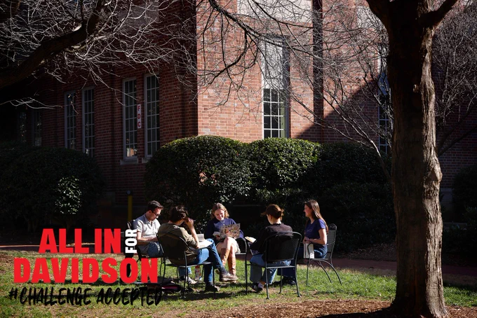 A photo of students studying together outdoors on Davidson College's campus.