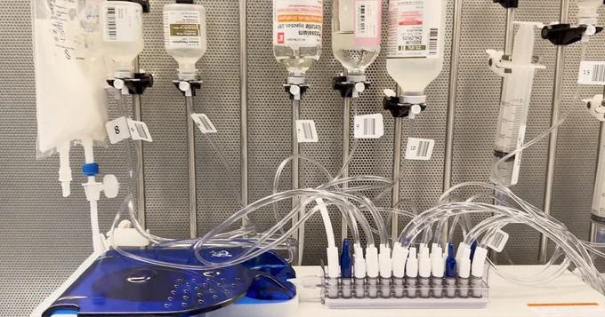 Bottles of medication with drip lines hanging down