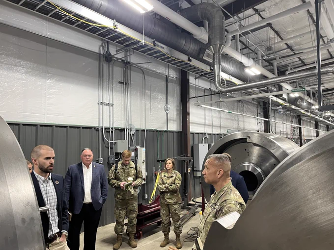 Five people standing inside of the Ballistic, Aero-optic and Material range on the Texas A&M RELLIS campus in Bryan, Texas.