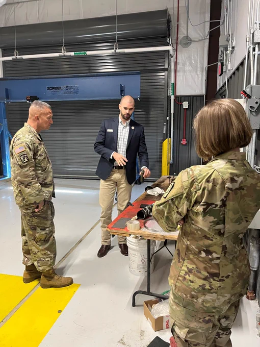 Three people standing inside of the Ballistic, Aero-optic and Material range on the Texas A&M RELLIS campus in Bryan, Texas.