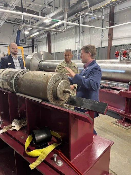 Three people standing inside of the Ballistic, Aero-optic and Material range on the Texas A&M RELLIS campus in Bryan, Texas.