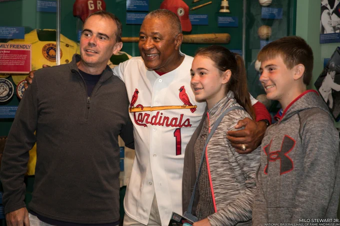 Ozzie Smith poses for a photo with fans during a Night at the Museum event. (Milo Stewart Jr./National Baseball Hall of Fame and Museum)