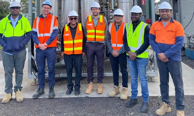 (L-R) Dr Ganesh Veluswamy (RMIT researcher), Ross Weston (Engineering Manager, South East Water), Dr Aravind Surapaneni (Principal Scientist, SEW), Eamon Casey (Technical Director, Iota), Profesor Kalpit Shah (Project Lead, RMIT), Dr Ibrahim Hakeem (RMIT researcher) and Dr Savankumar Patel (RMIT researcher) in front of the PYROCO technology. 