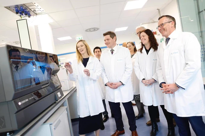 Photograph of Minister Peter Burke and Dr Darrin Morrissey, CEO NIBRT, and Dr Fiona Killard Lynch, CSO and Director of Research and Innovation, NIBRT and others at the CONCEPT lab at NIBRT Facility, Dublin