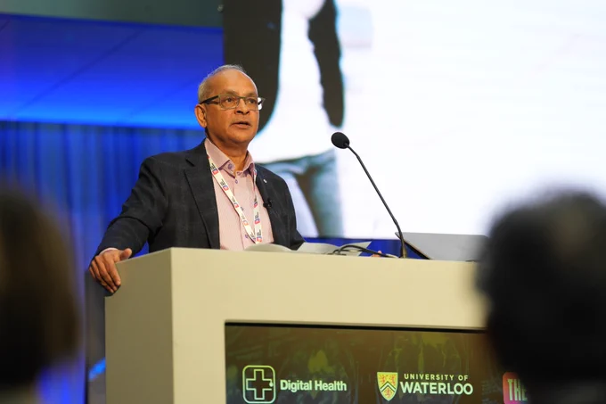 President and Vice-Chancellor Vivek Goel on stage of THE Digital Health summit making his opening remarks