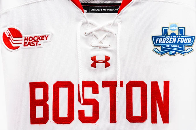 Close-up of white Boston University hockey jersey with 2025 Men's Frozen Four patch.