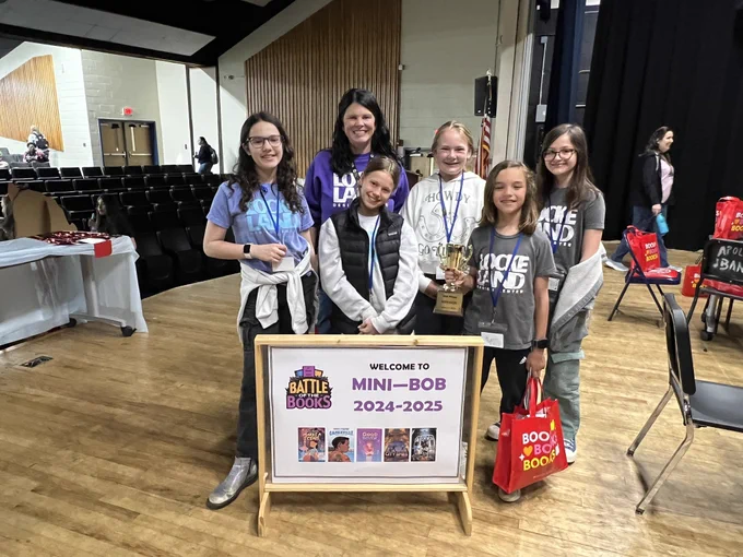 Students won second place at the battle of the books pose for a picture.