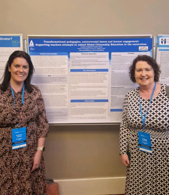 Deirdre standing on the left and Maria on the right of their research poster at ESAI conference.