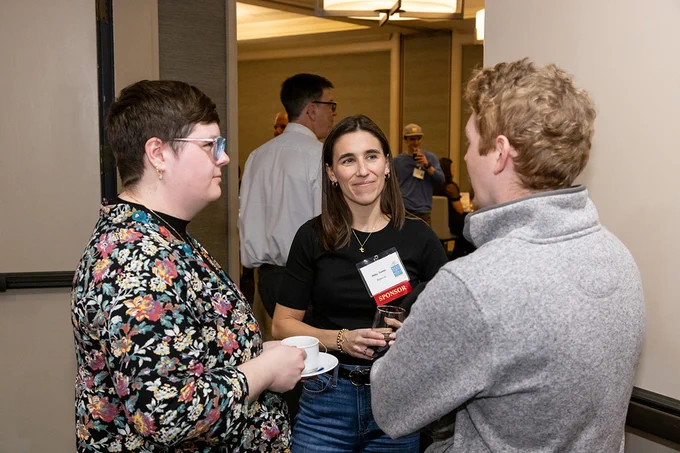 The Bytes.co team standing and talking at the Best Places to Work in Vermont 2025 event