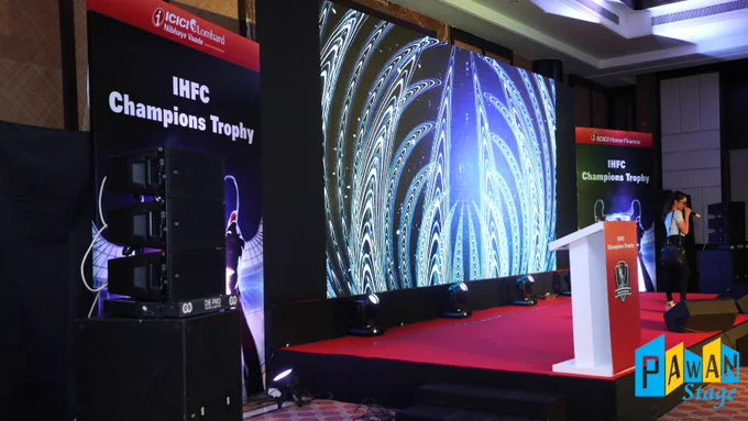  Corporate event stage in Ananta Udaipur, equipped with a large screen and speakers for effective communication and entertainment.