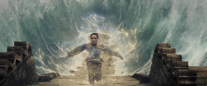 Frame grab from The Wheel of Time Season 3, Episode 8. Nynaeve is channeling and water is rising up all around her as she climbs up steps.