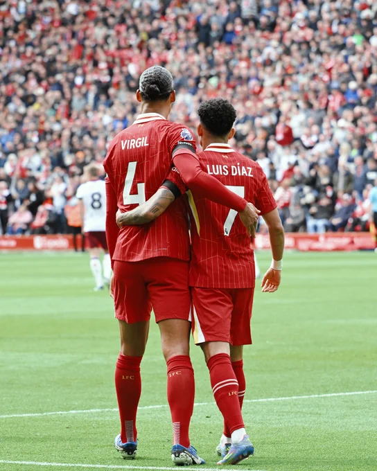 Van Dijk and Diaz celebrate the goal.