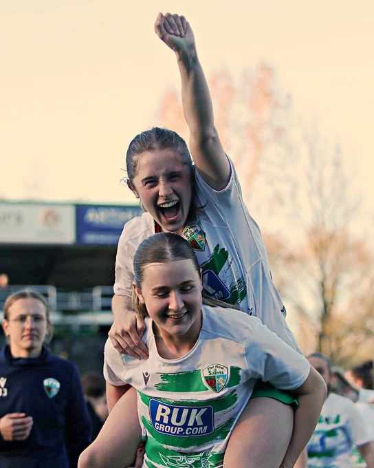 Grace Dunkerley and Lexi Jones celebrate The New Saints' win over Wrexham. 