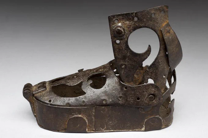 A metal ankle support consisting of a boot and leg support