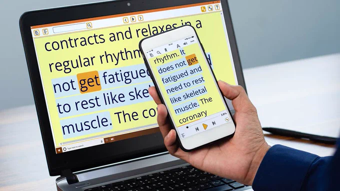 Identical words displayed on a laptop and smartphone. The words are enlarged, on a yellow background with a sentence highlighted in a contrasting blue colour