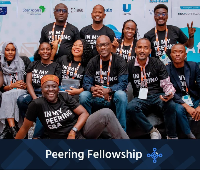 A group of people wearing black shirts that say "in my peering era"
