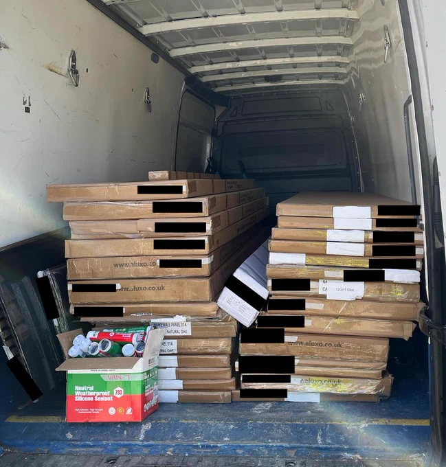 Van cargo of multiple kitchen worktops and silicone tubes - out for delivery.