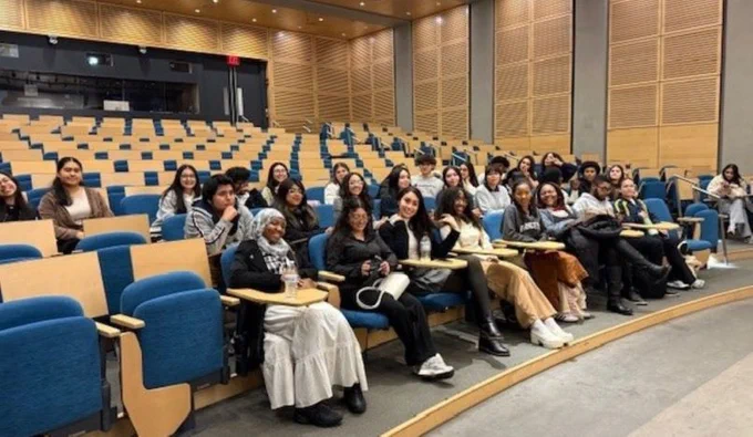 Students seated at Frick auditorium waiting for demonstations to begin