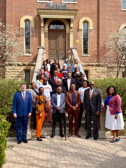 Program participants in the Future Professors Programme (FPP) and the Accelerated Academic Mentors Programme (AAMP) pose for a photo alongside Illinois International leadership and Illinois Chancellor Robert Jones outside of the Illini Union on April 14, 2025. 