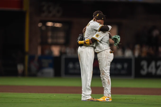 Luis Arraez and Manny Machado hugging after the final out of tonight's game. 