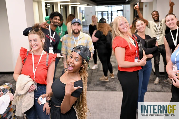 A photo of Interns and young professionals in the InternGF Summer Cohort. The people in the photo are smiling.