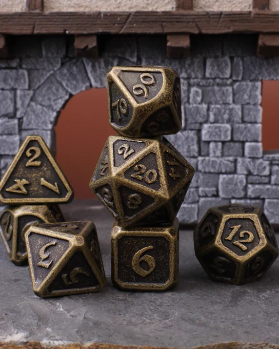 Die Hard Dice's classic Dark Gold mythica 7 piece rpg set. Metal RPG Dice.