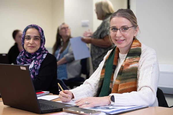 Two people learning at an Adult Education course