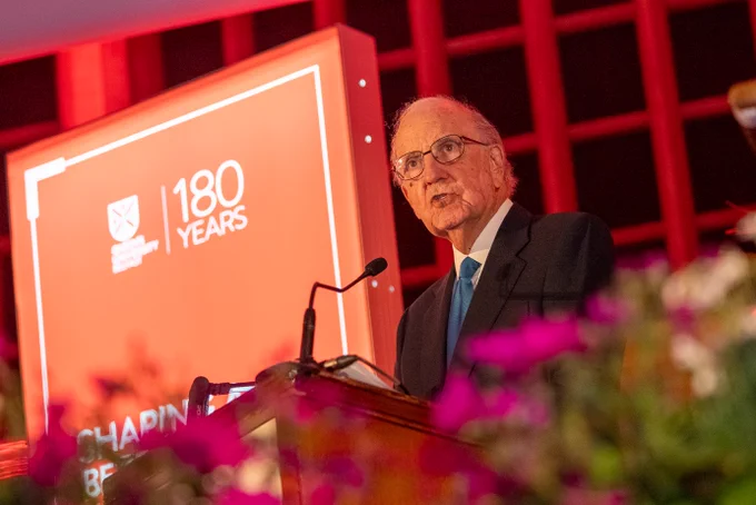 Image shows Chancellor Emeritus Senator George J. Mitchell speaking on stage in the Whitla Hall.