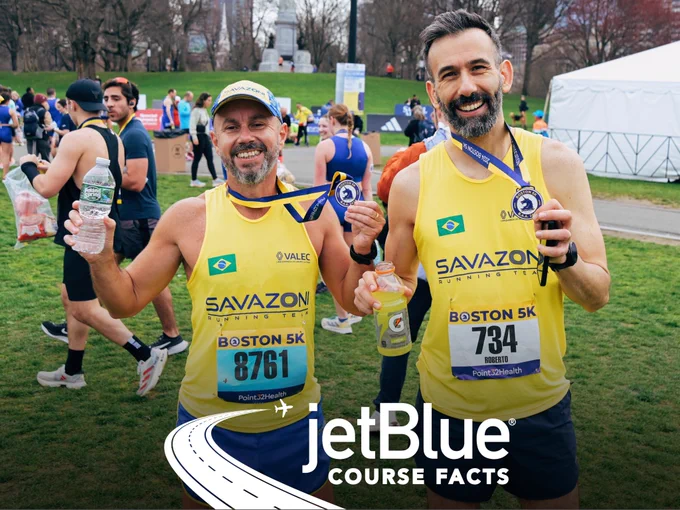Two 2024 Boston 5K participants showcasing their unicorn medals