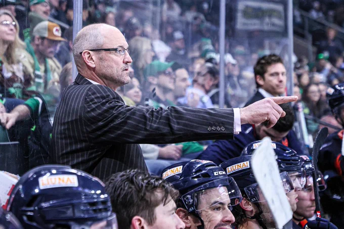 Dan Bylsma points while coaching during a Coachella Valley Firebirds game.