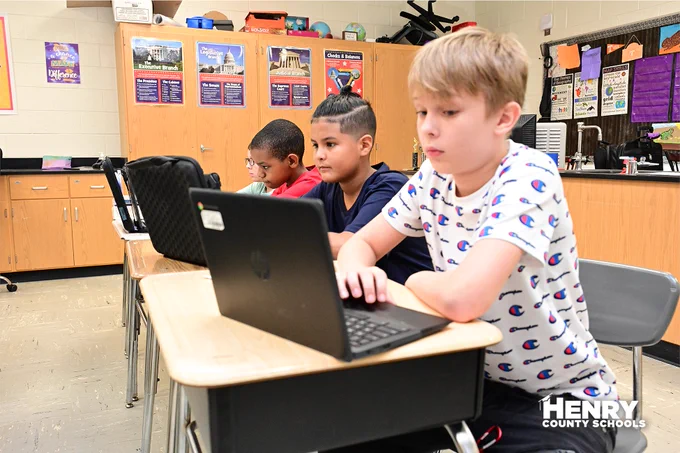 students looking at laptops