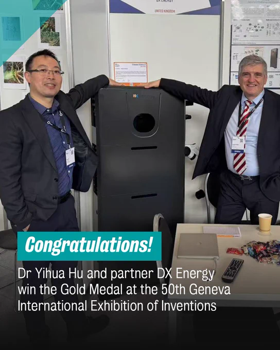 Dr Yihua Hu and his colleague at DX Energy smile as they pose next to their Home Energy Router invention.

Text reads: Congraduations Dr Yihua Hu and partner DX Energy win the Gold Medal at the 50th Geneva International Exhibition of Inventions