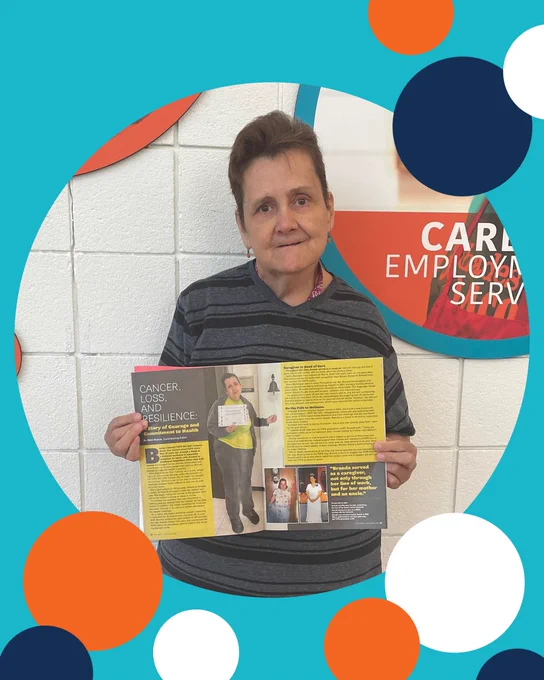 photo of Brenda holding up a TOPs Magazine.