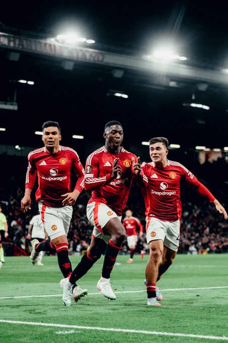 Kobbie Mainoo celebrates.