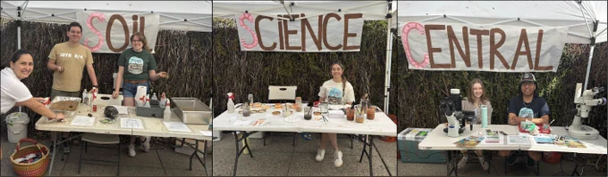 Three booths with white tables and tents are hosted by SBG graduate students. Pink and brown banners state "Soil Science Central."