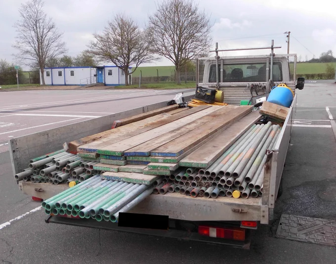 Rear view of non-compliant lights goods vehicle overloaded and insecure