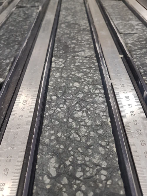 Serpentinized harzburgites recovered during Expedition 399. Photo credit: Johan Lissenberg/Cardiff University and IODP JRSO.