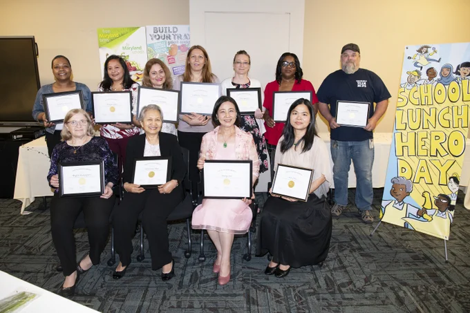 Lunch heroes together with their awards