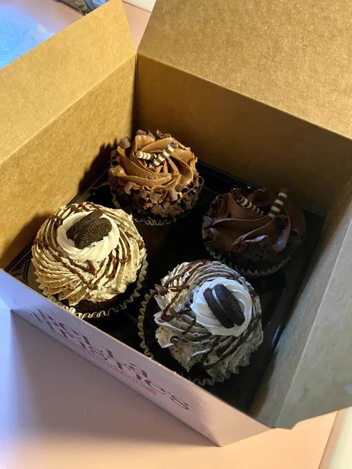 Four bougie cupcakes in a box. Two chocolate lovers and two cookies and cream.