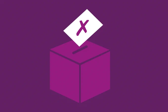 A piece of paper with a cross on it representing a vote is being inserted into a purple voting box on a purple background.