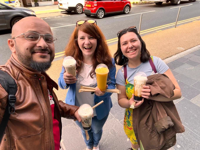 The DiveIn Team holding Boba tea drinks on Byres road