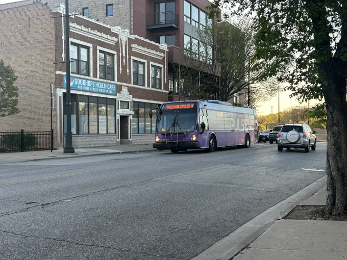 Pace pulse bus drives down Milwaukee Ave
