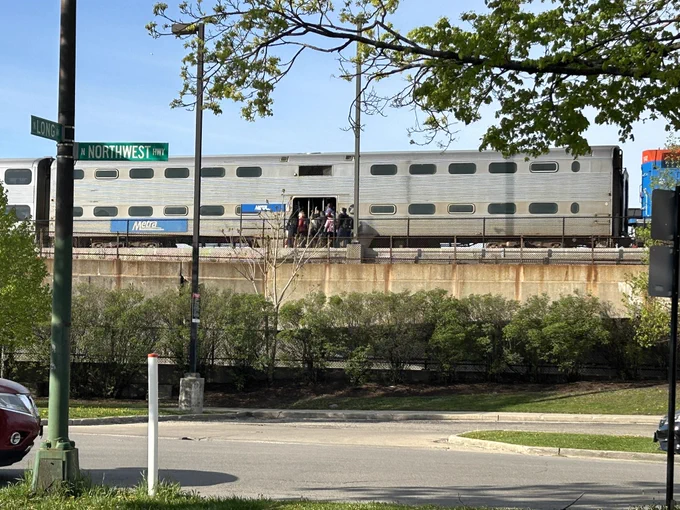 Metra UP northwest train picks up passengers at the Jefferson park station