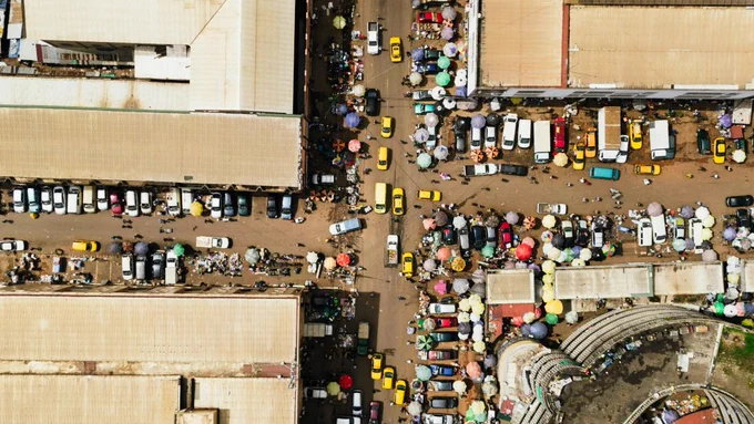 Drone photograph of busy market. Yaoundé, Cameroon. Photo by Kelly     from Pexels: https://www.pexels.com/photo/crowded-street-in-nigeria-17290985/