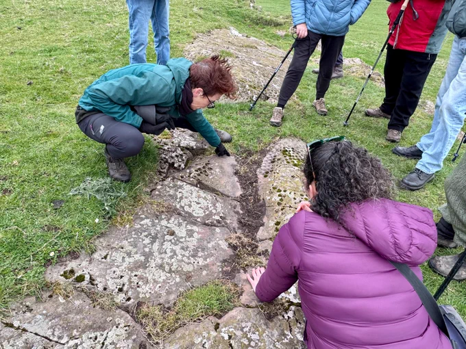 Tertia and Joana showcasing the rock art at High Banks farm