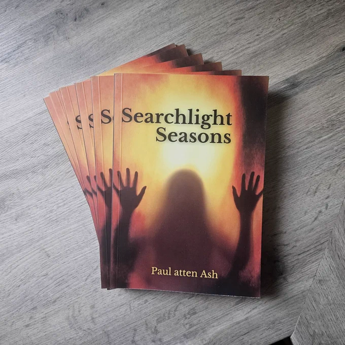 Copies of Searchlight Seasons fanned out on a grey kitchen counter