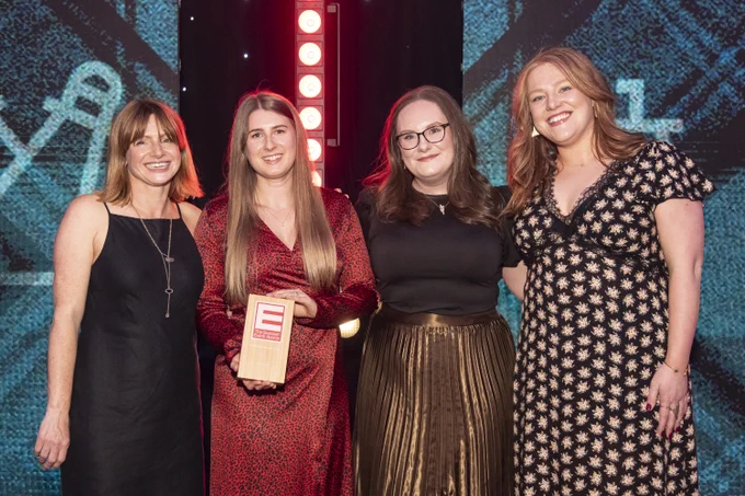 Four VisitScotland staff accepting an award.