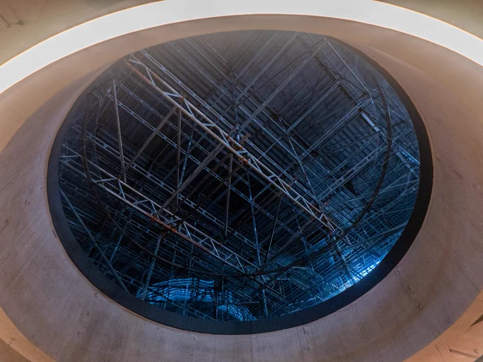 Photo of scaffolding looking up through a well in the ceiling of the National Maritime Museum's ground floor