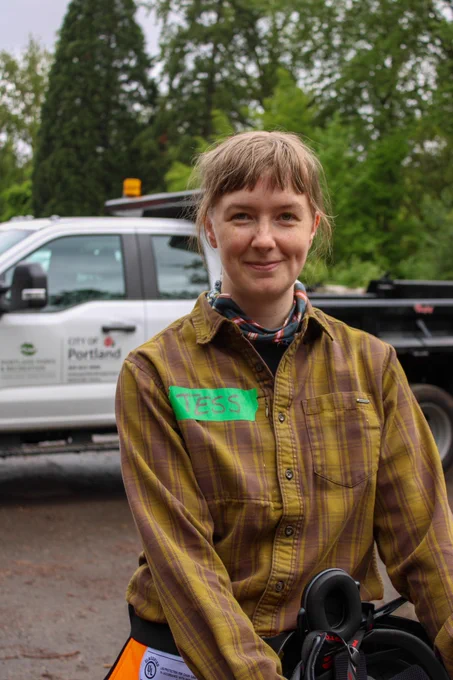 Arborist trainee posing for a picture outside.