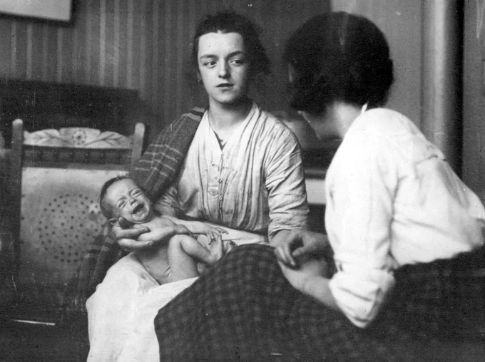Cowcaddens, 1922
Cowcaddens Day Nursery showing mother being interviewed by health worker from photographs from the Environmnetal Health Dept. Glasgow City Archives Ref: P5035